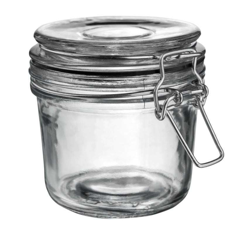 Clear glass jar with a metal clasp on a white background