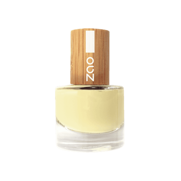Bottle of Zao nail polish with a wooden cap on a solid background