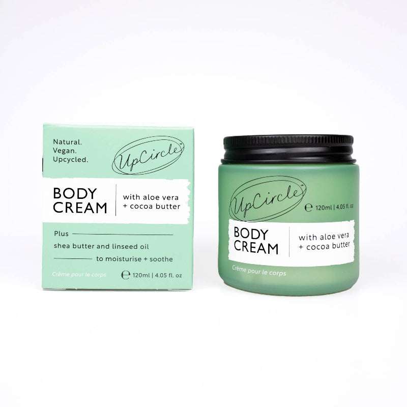 UpCircle body cream jar and packaging on a white background