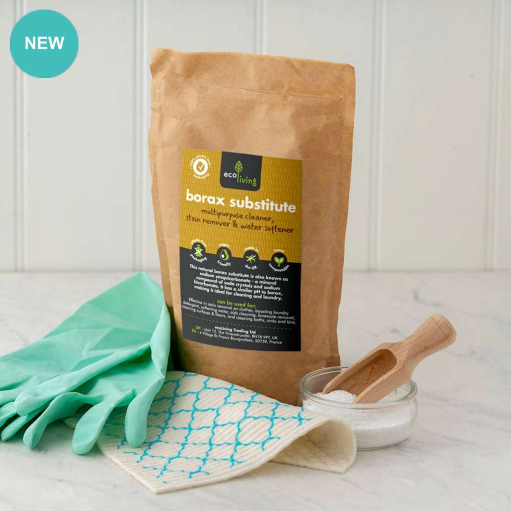 Borax Substitute (750g) in eco-friendly packaging with cleaning gloves, cloth, and wooden scoop on a marble surface