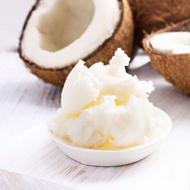 Raw Coconut Oil ORGANIC (per 100g) with natural coconut halves showcasing sustainable, cruelty-free, and ethical product qualities