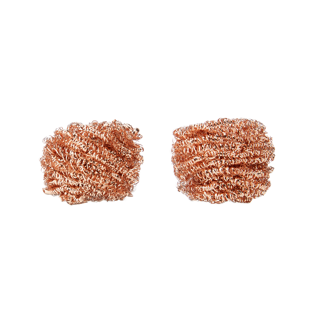 Two copper scrubbies on a white background