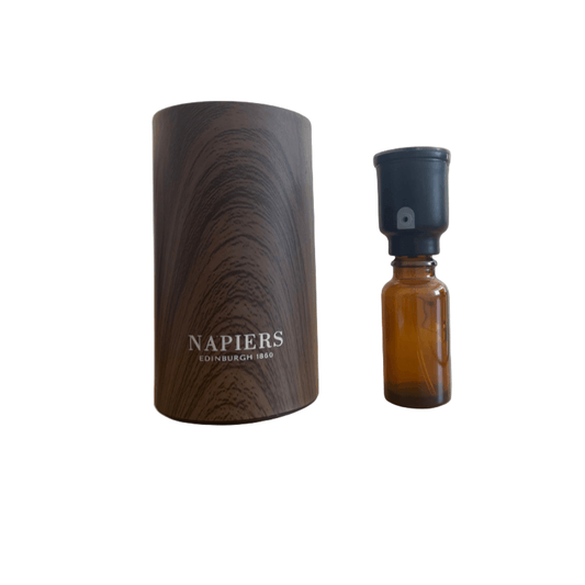 Brown wooden nebuliser and small brown bottle glass on a white background