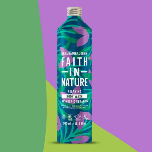 Bottle of Faith in Nature body wash with a colorful label on a green and purple gradient background