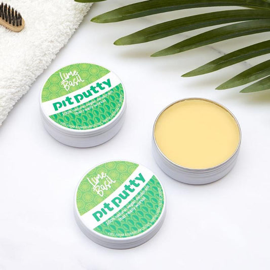 Natural ORGANIC Deodorant in Tin displayed with green leafy background and white towel for a fresh, eco-friendly look