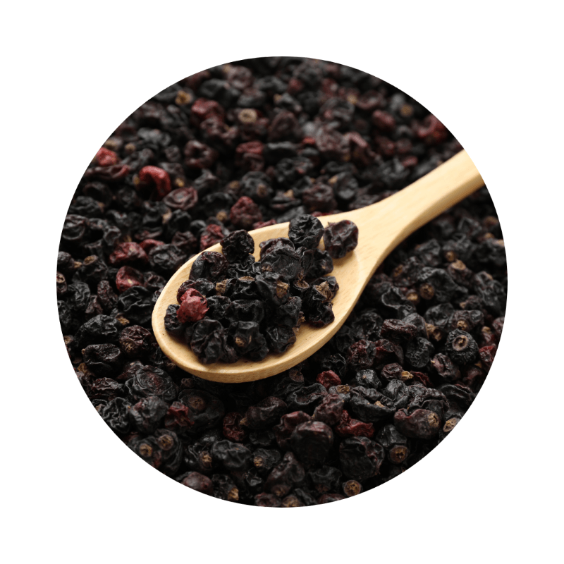 Close-up of dried dark berries in a wooden spoon showcasing Currants ORGANIC (500g) for loose organic food and refill shop use.