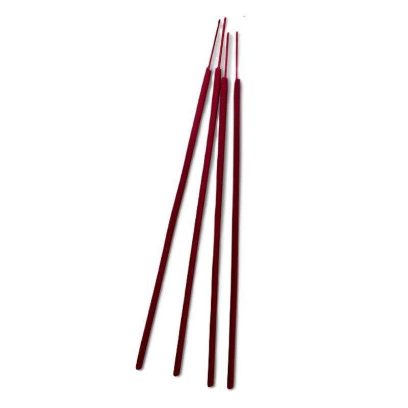 Set of red incense sticks on a white background