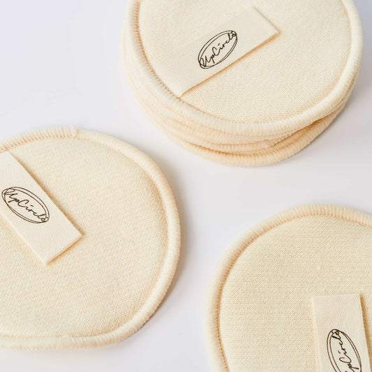 Three beige circular pads with UpCircle logo on a white background