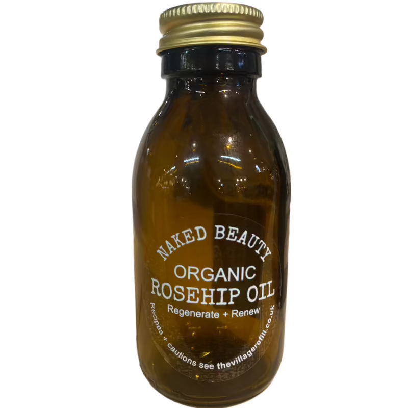 Amber glass bottle of Rosehip Seed Oil with gold cap labeled organic for natural skincare and renewal benefits