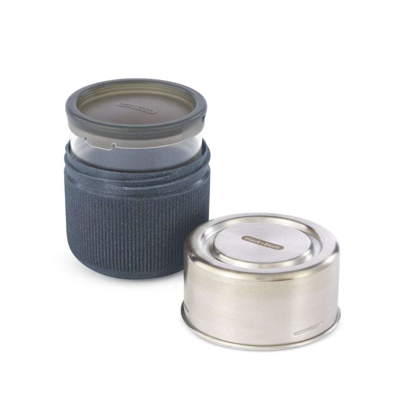 Two cylindrical containers with lids on a white background