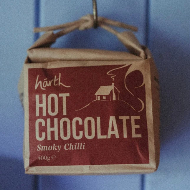 Brown paper packaging of Hot Chocolate ORGANIC (400g) with smoky chilli flavor, sustainable and cruelty-free product.