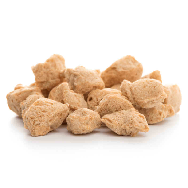 Close-up of light brown textured chunks of Soya Chunks (per 300g) displayed on a white background