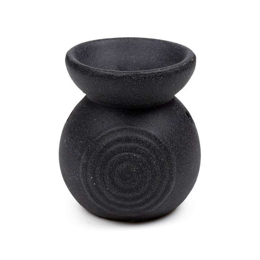 Black textured oil burner on a white background