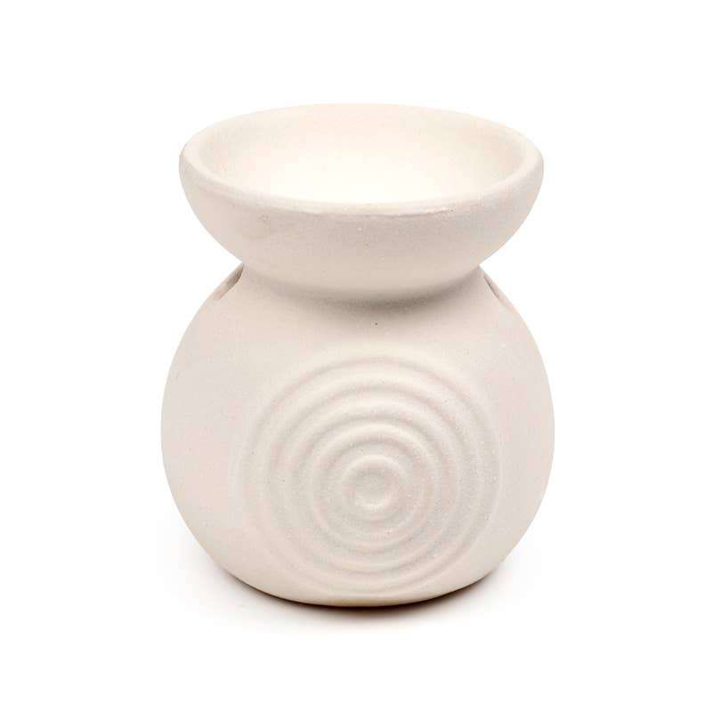 White ceramic oil burner with circular design on a white background