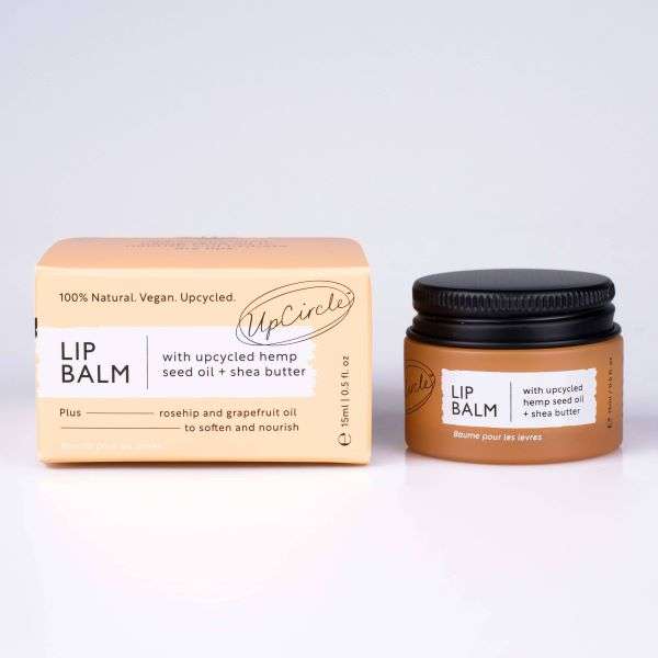 Lip balm jar and packaging with 'UpCircle' branding on a white background