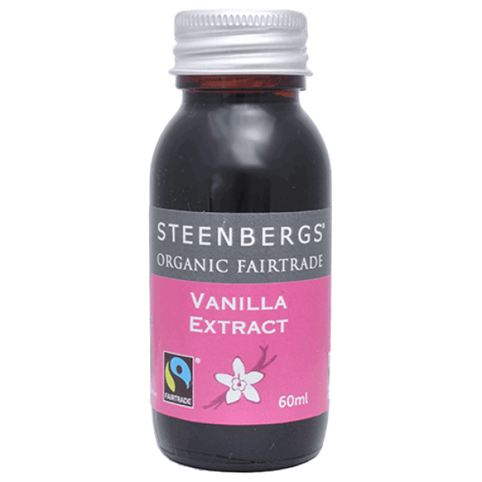 Small dark glass bottle with silver cap labeled Vanilla Extract ORGANIC (60ml) featuring fairtrade and organic markings