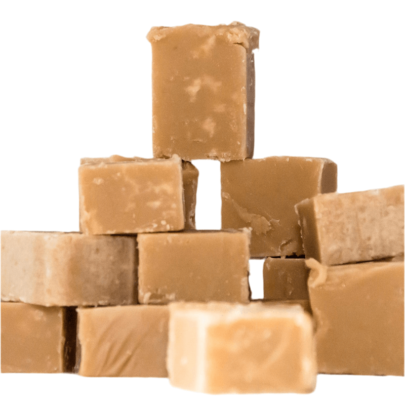 Stack of brown fudge pieces on a white background
