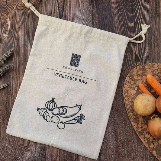 New Living vegetable bag on a wooden surface with vegetables around
