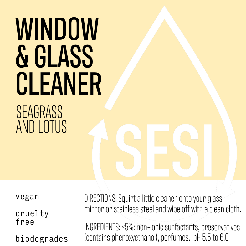 Label of a window and glass cleaner with sea grass and lotus scents, indicating the product is vegan, cruelty-free, and biodegradable.