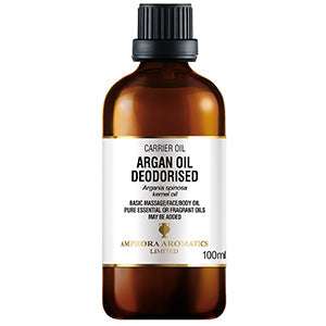 Amber bottle of Argan Oil (100ml) with black cap, labeled as deodorised carrier oil for skin and massage use.