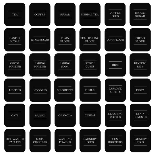 A grid of 32 rounded black labels on a white background, each labeled with a different household or kitchen item such as tea, coffee, sugar, flour, rice, pasta, oats, and cleaning cloths.