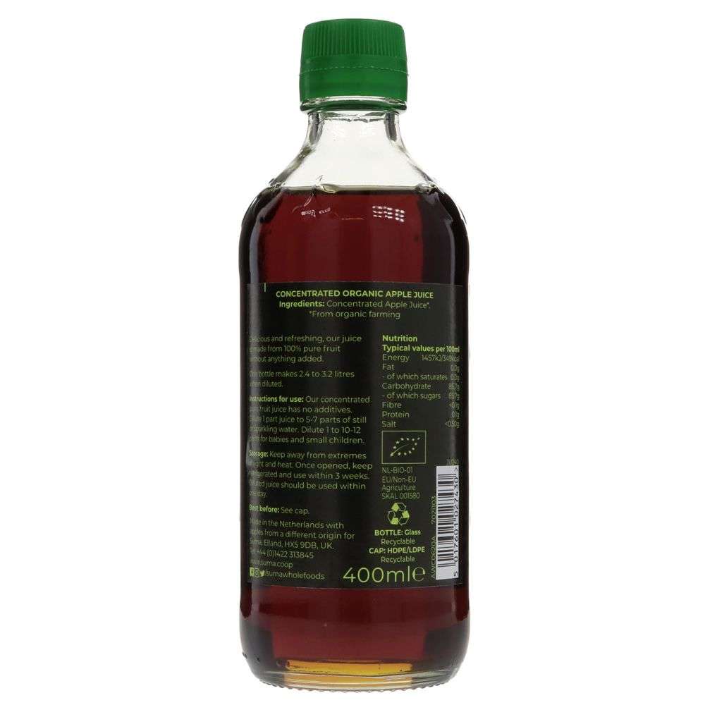 Bottle of concentrated organic apple juice with a green cap on a white background