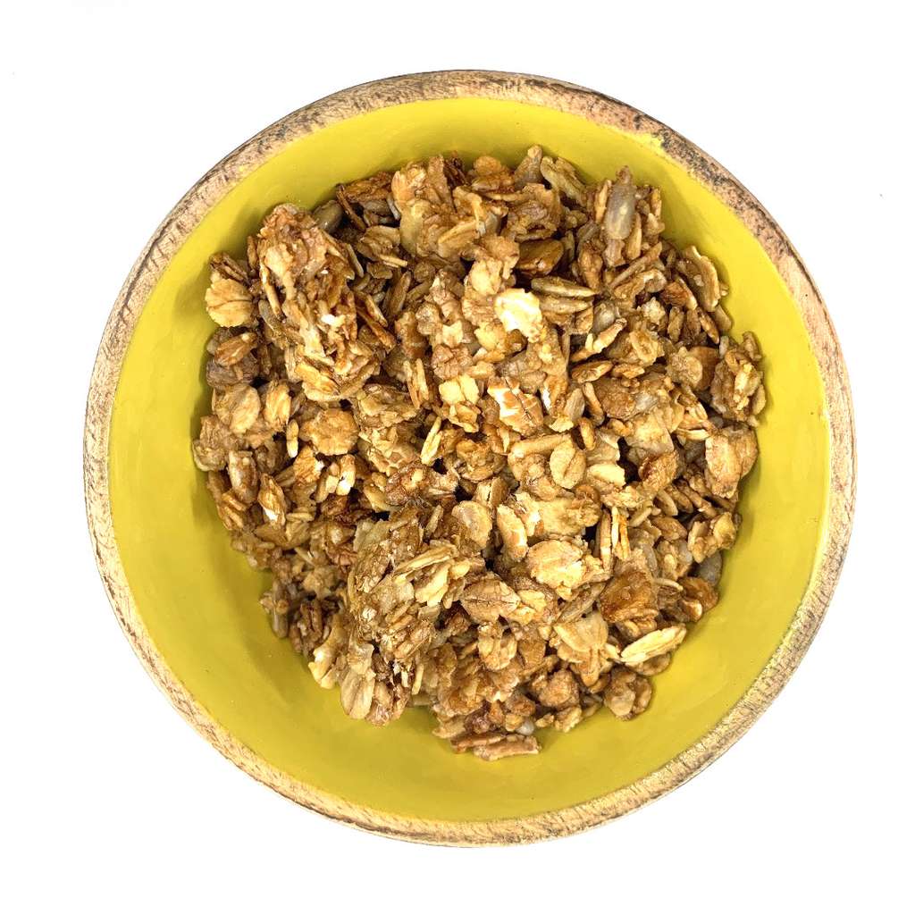 Top view of Granola ORGANIC (per 500g) served in a yellow bowl showcasing natural, plant-based ingredients.