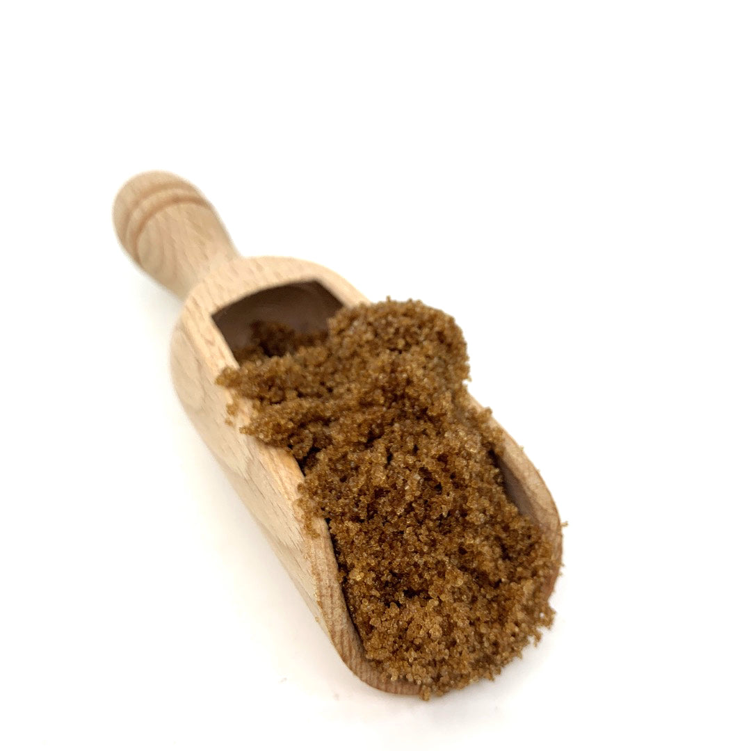 Light Muscovado sugar (per 500g) heaped in a wooden scoop, ideal for organic and plastic free refill shops.