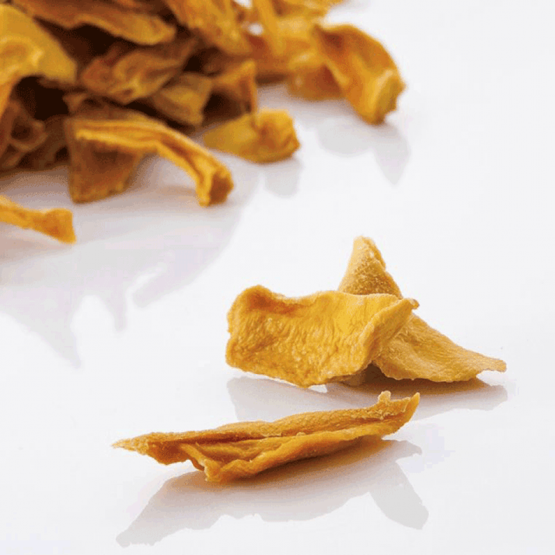 Dried Mango Strips ORGANIC (per 100g) shown on white surface with natural texture and rich golden color