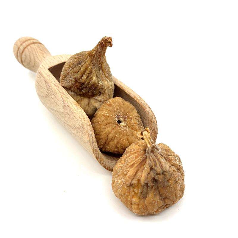 Three dried figs ORGANIC (per 200g) in a wooden scoop on a white background, natural and organic food product.