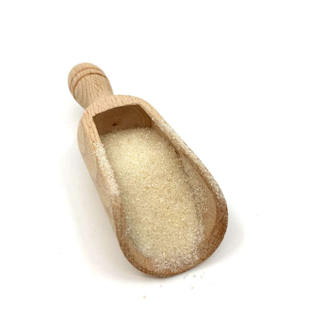 Wooden scoop filled with Fine Golden (Caster) Sugar ORGANIC (per 500g) on a white background