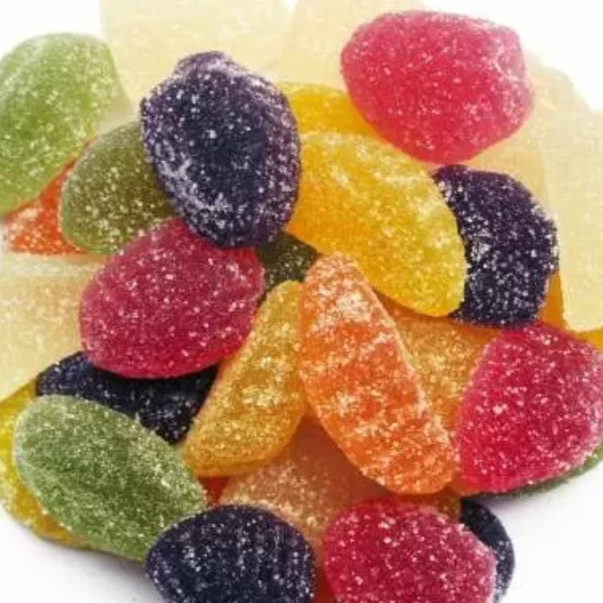 Colorful sugar-coated fruit jellies piled together, showcasing Fruit Jellies (per 100g) in a vibrant mix.
