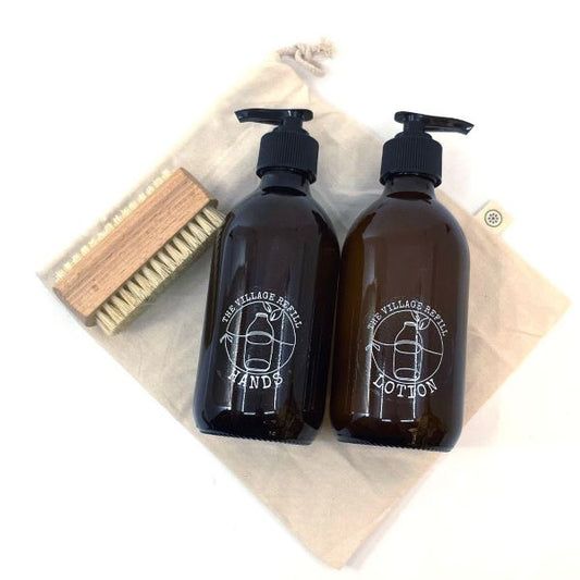 HAND Care Starter Kit with natural skincare bottles and a wooden brush on a reusable cloth bag
