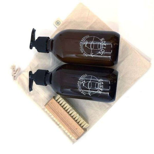 HAND Care Starter Kit with natural skincare bottles and a wooden brush on a reusable cloth bag
