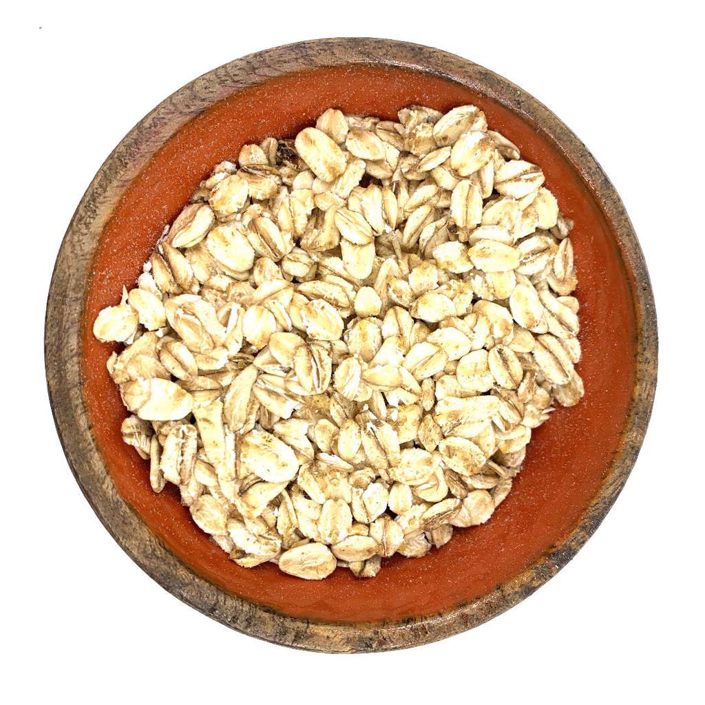 Close-up of a wooden bowl filled with Gluten-Free Jumbo Oats ORGANIC (per 500g) flakes in natural light