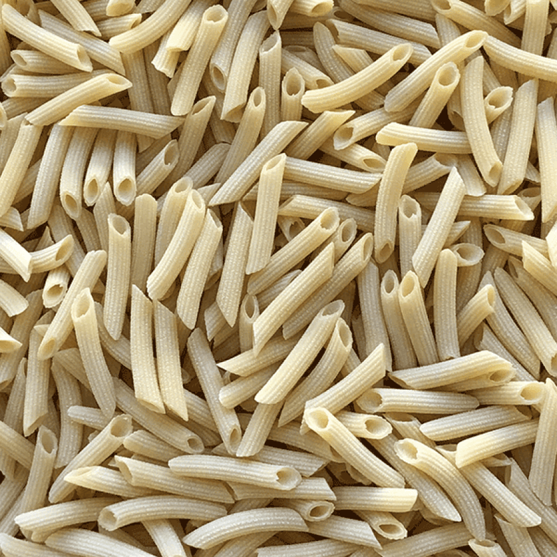 Close-up of uncooked penne pasta