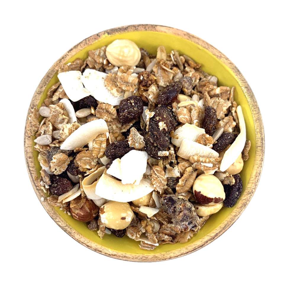 Bowl of Super Hi-Fibre Cereal ORGANIC (per 500g) with nuts, dried fruit, seeds, and grains in a natural, eco-friendly setting