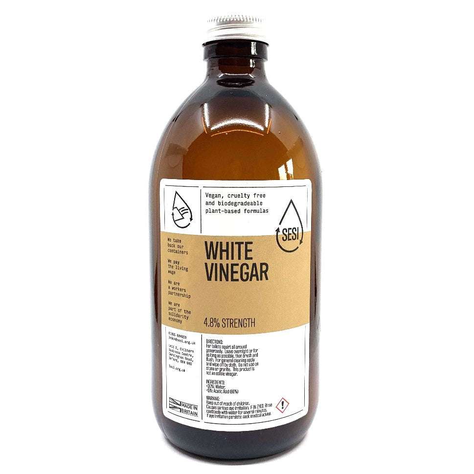Brown glass bottle of White CLEANING Vinegar with plant-based formula label and silver cap for household use