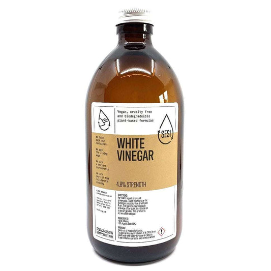 Brown glass bottle of White CLEANING Vinegar with plant-based formula label and silver cap for household use