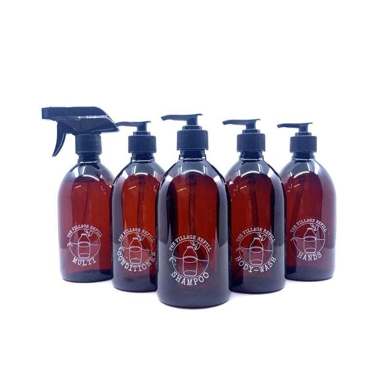 Group of refillable amber bottles with pump and spray tops showcasing Forever Refillable bottle (500ml) plastic free household essentials