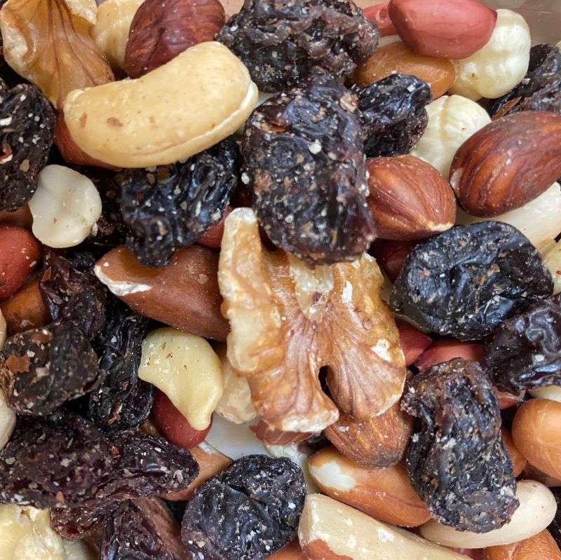 Close-up of assorted dried fruits and nuts in Natural Skincare style for Luxury Dried Fruit & Nut Mix (per 100g)