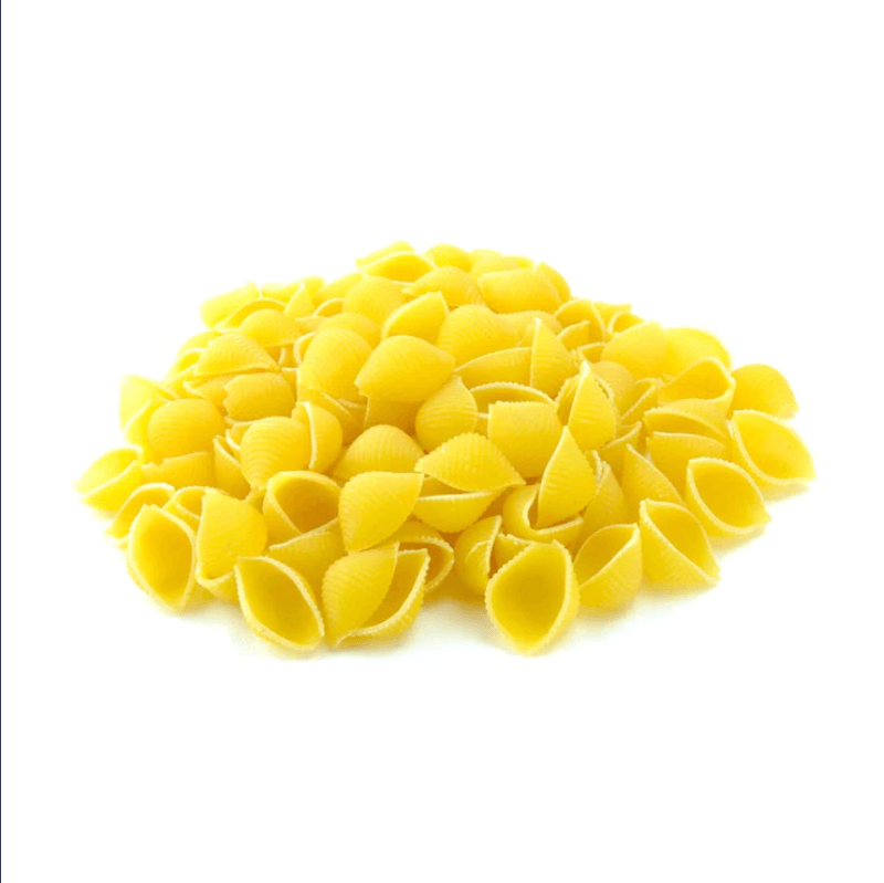 Pile of bright yellow Pasta Shells (per 500g) against white background highlighting natural and sustainable food choice