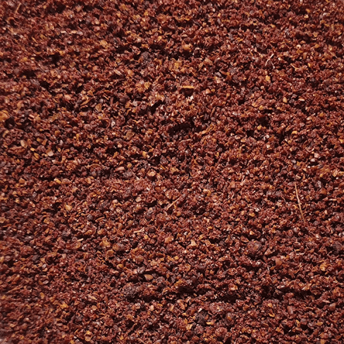 Close-up of organic crushed sumac spice in deep red tones for Suma ORGANIC (per 50g) from a refill shop