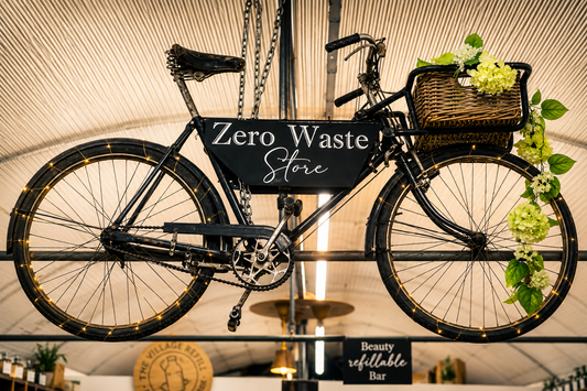 Vintage bicycle hanging in The Village Refill Zero Waste Store, representing reuse, repair and sustainable living.