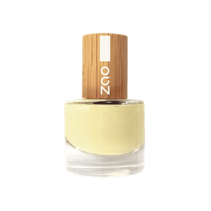 Bottle of Zao nail polish with a wooden cap on a solid background