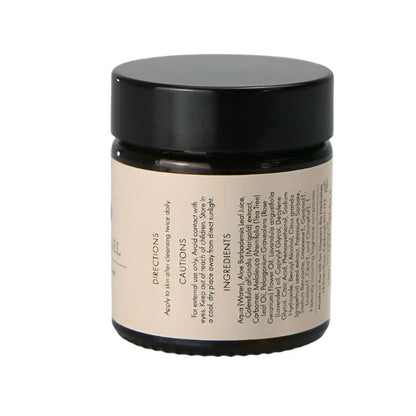 Cosmetic jar with black lid and beige label on a white background
