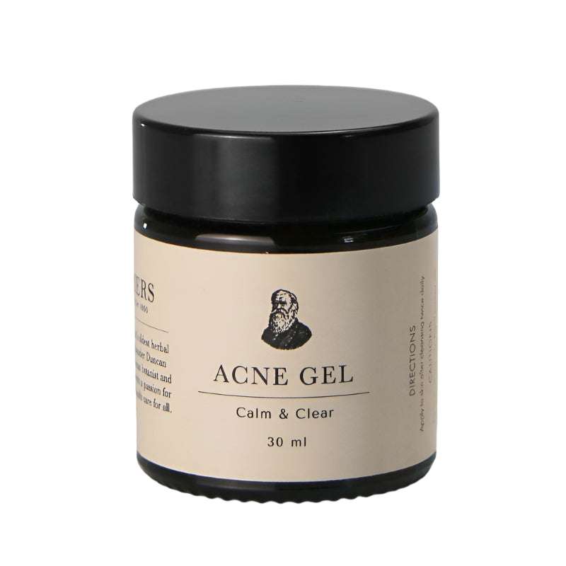 Acne gel jar with black lid and beige label on a white background