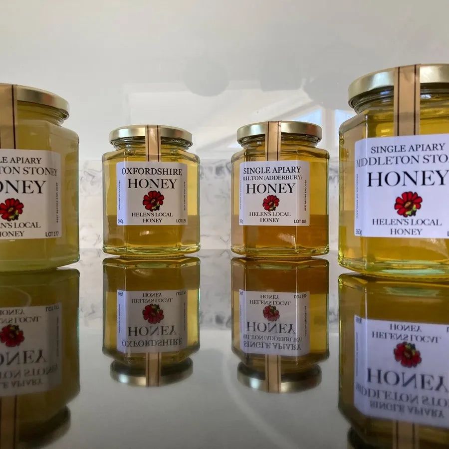 Two jars of Oxfordshire Honey (360g) displayed alongside other local honey jars in a refill shop setting