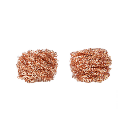 Two copper scrubbies on a white background