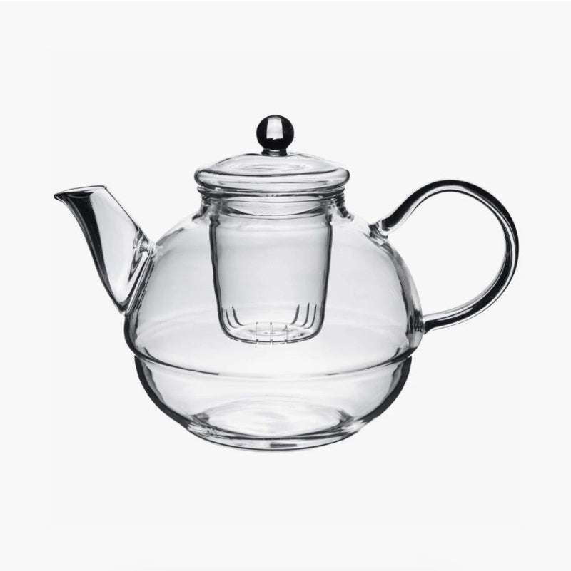 Clear glass teapot with integrated strainer and handle for brewing tea in the Glass Tea-For-One Tea Pot, Cup and Strainer Set